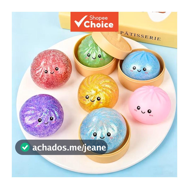 Brinquedo sensorial antiestresse em forma de pão cozido no vapor com glitter, acompanhado de mini cestinha a vapor.