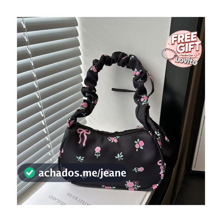 Bolsa floral com desenho único, com prega e cordão, estilosa e versátil, para ombro ou sob o braço.